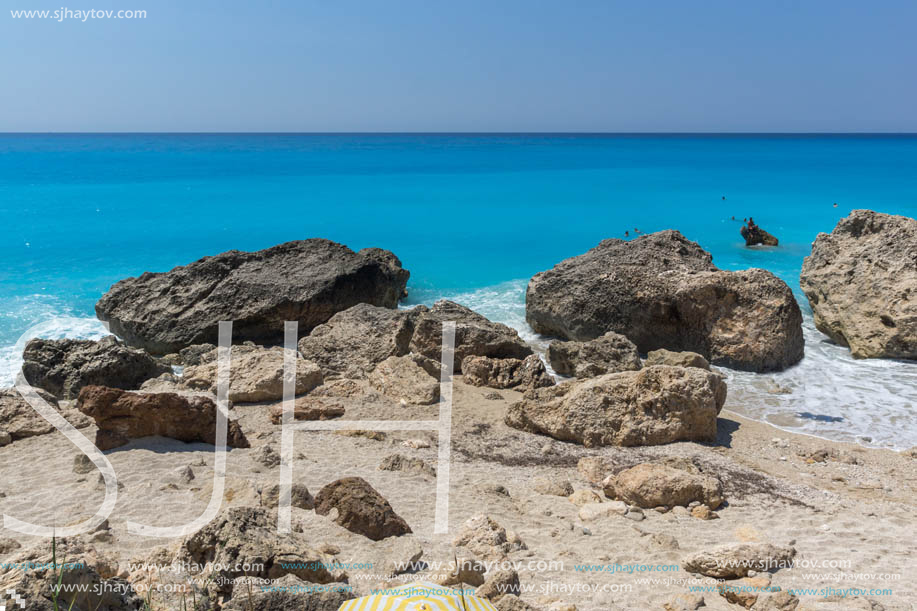 MEGALI PETRA BEACH, LEFKADA, GREECE - JULY 16, 2014: Panoramic view of blue waters of Megali Petra Beach, Lefkada, Ionian Islands, Greece