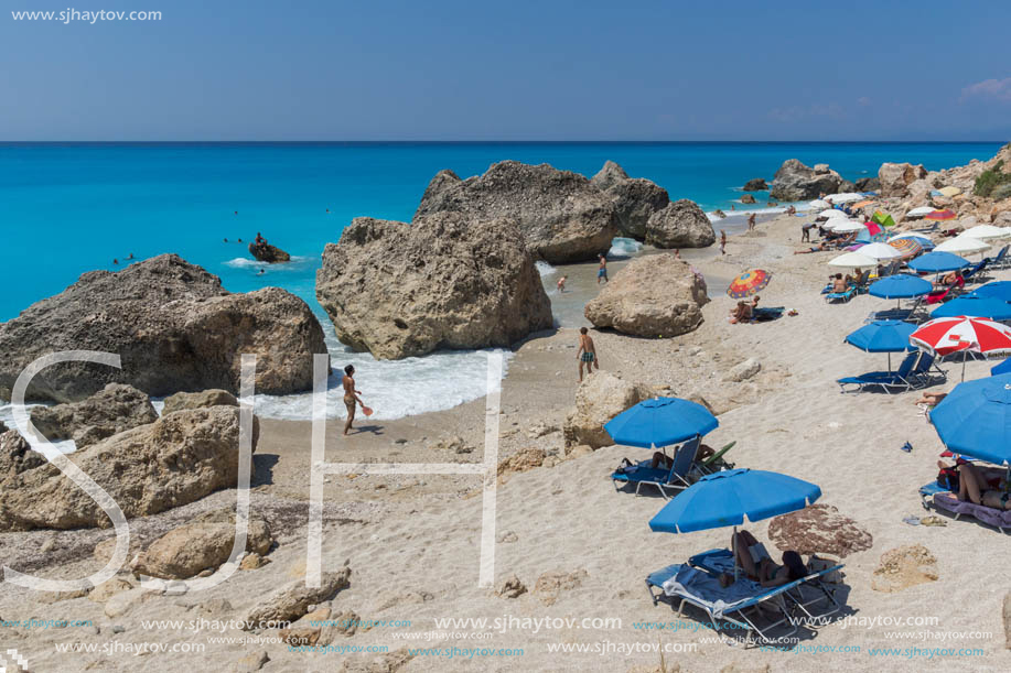 MEGALI PETRA BEACH, LEFKADA, GREECE - JULY 16, 2014: Panoramic view of blue waters of Megali Petra Beach, Lefkada, Ionian Islands, Greece