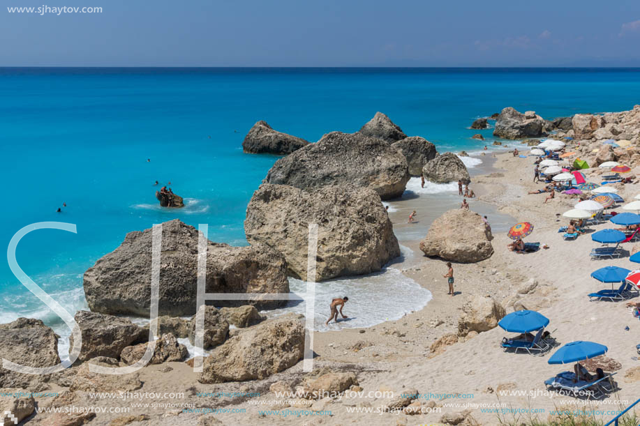 MEGALI PETRA BEACH, LEFKADA, GREECE - JULY 16, 2014: Panoramic view of blue waters of Megali Petra Beach, Lefkada, Ionian Islands, Greece