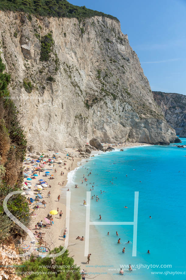 PORTO KATSIKI BEACH, LEFKADA, GREECE - JULY 16, 2014: People visiting Porto Katsiki Beach with blue waters, Lefkada, Ionian Islands, Greece