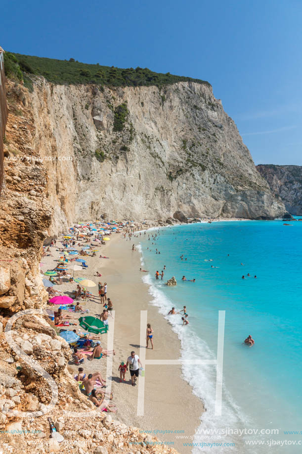 PORTO KATSIKI BEACH, LEFKADA, GREECE - JULY 16, 2014: People visiting Porto Katsiki Beach with blue waters, Lefkada, Ionian Islands, Greece