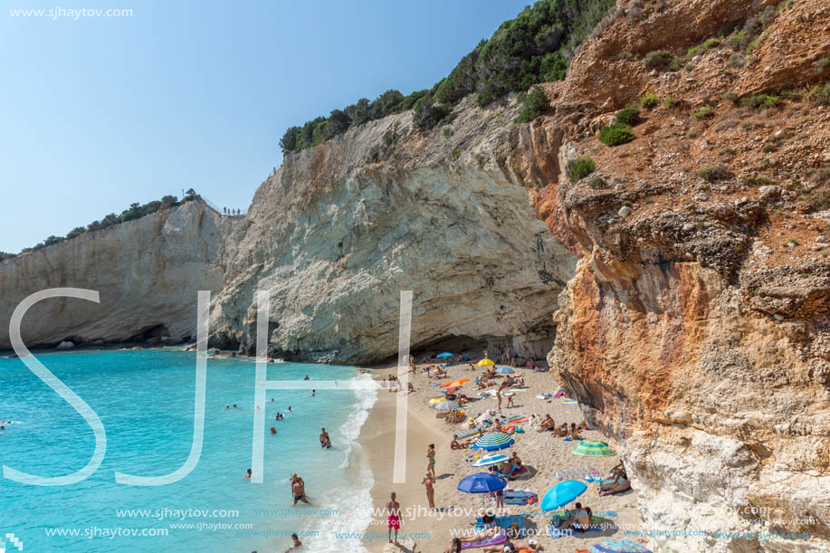 PORTO KATSIKI BEACH, LEFKADA, GREECE - JULY 16, 2014: People visiting Porto Katsiki Beach with blue waters, Lefkada, Ionian Islands, Greece