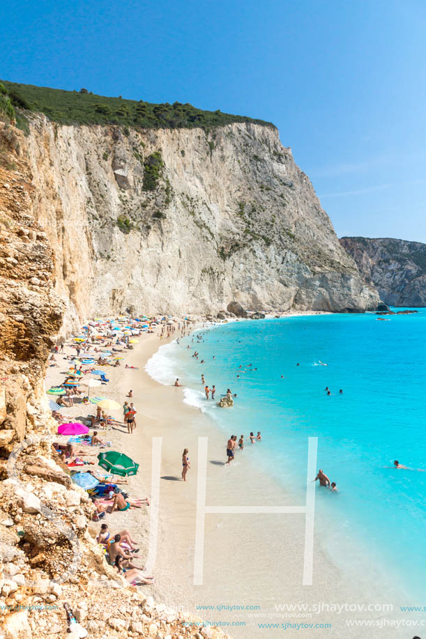 PORTO KATSIKI BEACH, LEFKADA, GREECE - JULY 16, 2014: People visiting Porto Katsiki Beach with blue waters, Lefkada, Ionian Islands, Greece