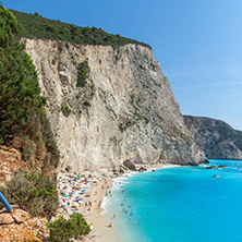 PORTO KATSIKI BEACH, LEFKADA, GREECE - JULY 16, 2014: People visiting Porto Katsiki Beach with blue waters, Lefkada, Ionian Islands, Greece