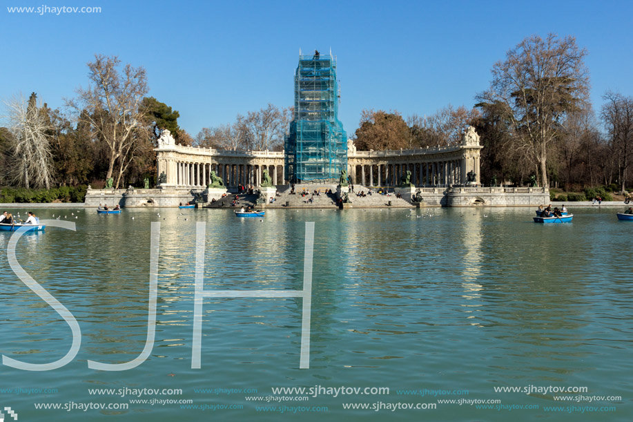 MADRID, SPAIN - JANUARY 22, 2018: Large pond of the Retiro and Monument to Alfonso XII in The Retiro Park in City of Madrid, Spain