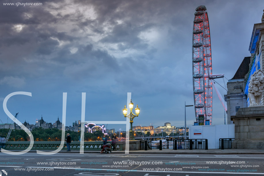 LONDON, ENGLAND - JUNE 16 2016: Night photo of The London Eye and County Hall from Westminster bridge, London, England, Great Britain