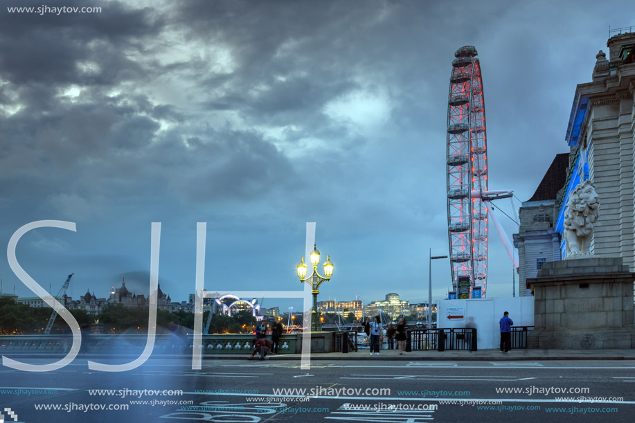 LONDON, ENGLAND - JUNE 16 2016: Night photo of The London Eye and County Hall from Westminster bridge, London, England, Great Britain