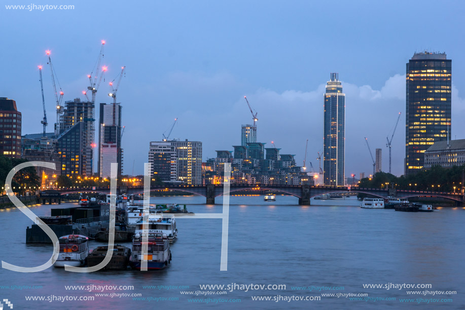 LONDON, ENGLAND - JUNE 16 2016: Night photo of The London Eye and County Hall from Westminster bridge, London, England, Great Britain