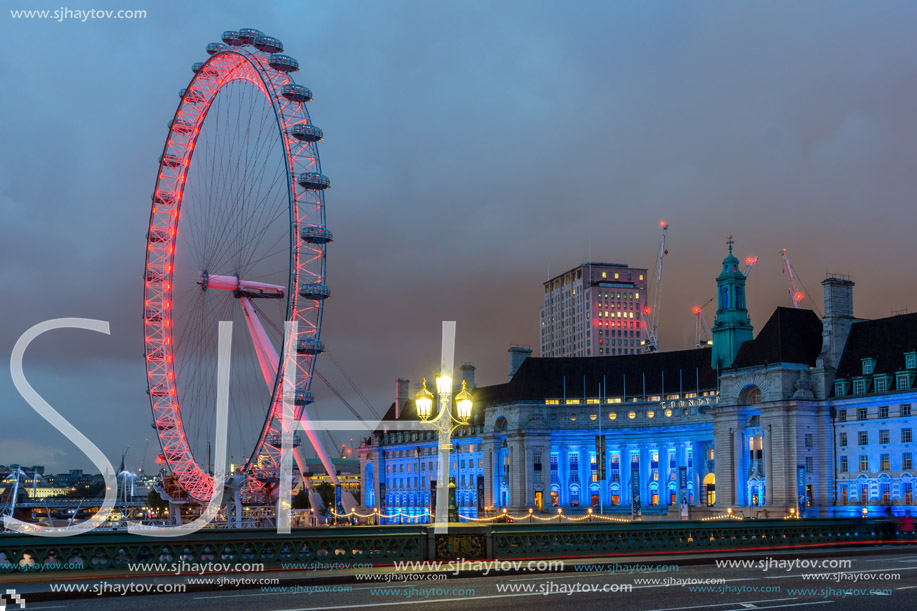 LONDON, ENGLAND - JUNE 16 2016: Night photo of The London Eye and County Hall from Westminster bridge, London, England, Great Britain