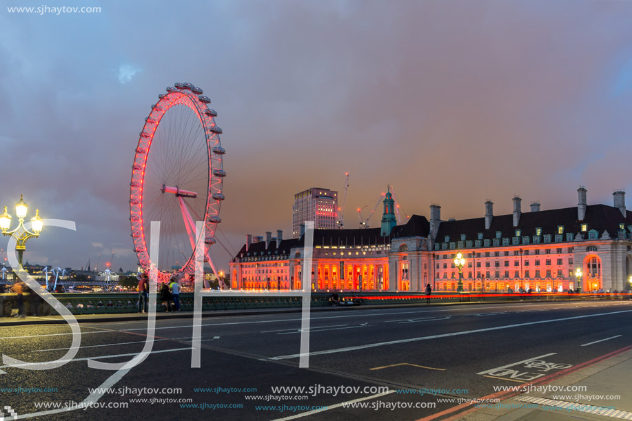 LONDON, ENGLAND - JUNE 16 2016: Night photo of The London Eye and County Hall from Westminster bridge, London, England, Great Britain