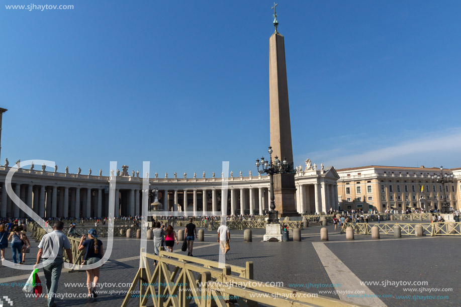 ROME, ITALY - JUNE 24, 2017: Tourists visit Saint Peter"s Square and St. Peter"s Basilica in Rome, Vatican, Italy