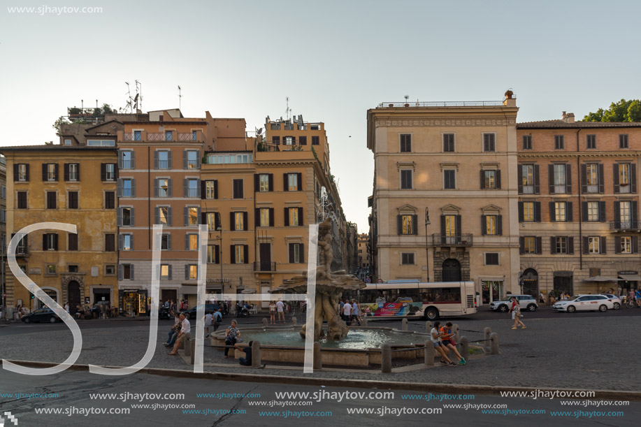 ROME, ITALY - JUNE 24, 2017: Yellow Sunset at Triton Fountain at Piazza Barberini in Rome, Italy