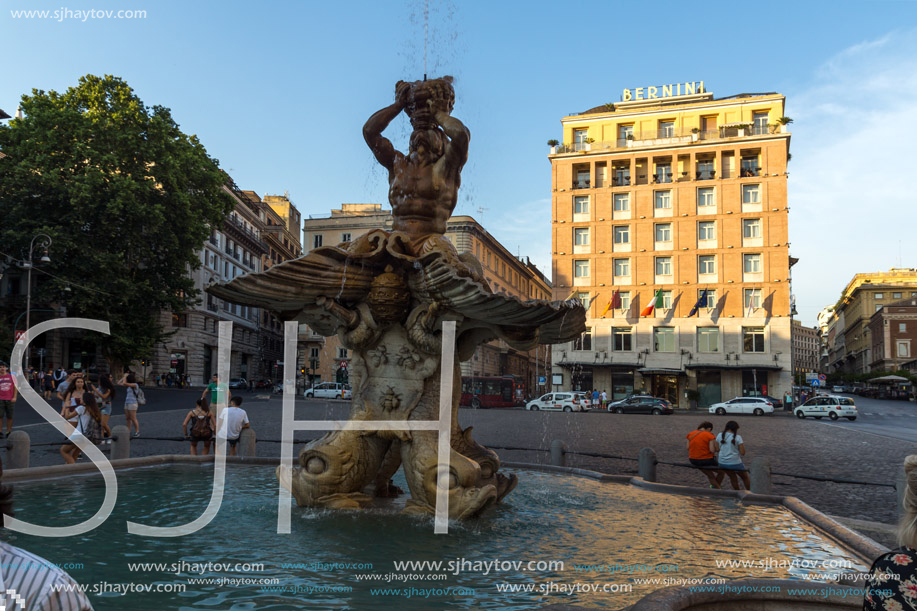 ROME, ITALY - JUNE 24, 2017: Yellow Sunset at Triton Fountain at Piazza Barberini in Rome, Italy