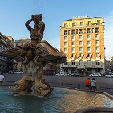 ROME, ITALY - JUNE 24, 2017: Yellow Sunset at Triton Fountain at Piazza Barberini in Rome, Italy