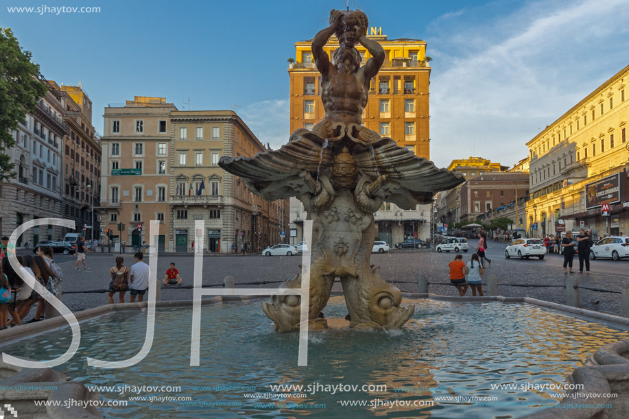 ROME, ITALY - JUNE 24, 2017: Yellow Sunset at Triton Fountain at Piazza Barberini in Rome, Italy