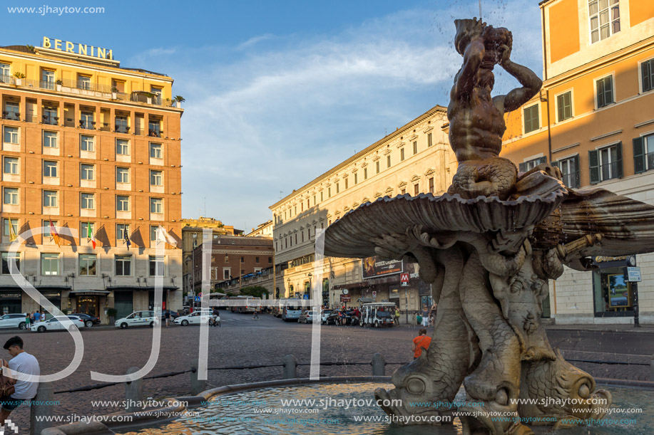 ROME, ITALY - JUNE 24, 2017: Yellow Sunset at Triton Fountain at Piazza Barberini in Rome, Italy