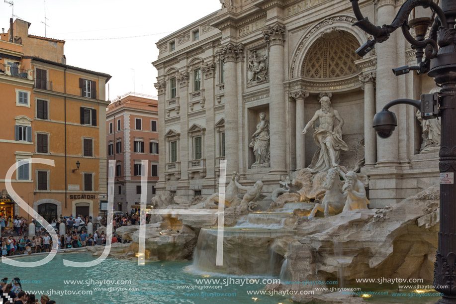 ROME, ITALY - JUNE 24, 2017: Sunset view of Tourist visiting Trevi Fountain (Fontana di Trevi) in city of Rome, Italy