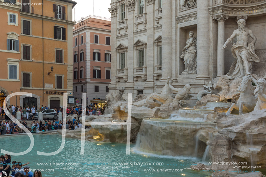 ROME, ITALY - JUNE 24, 2017: Sunset view of Tourist visiting Trevi Fountain (Fontana di Trevi) in city of Rome, Italy