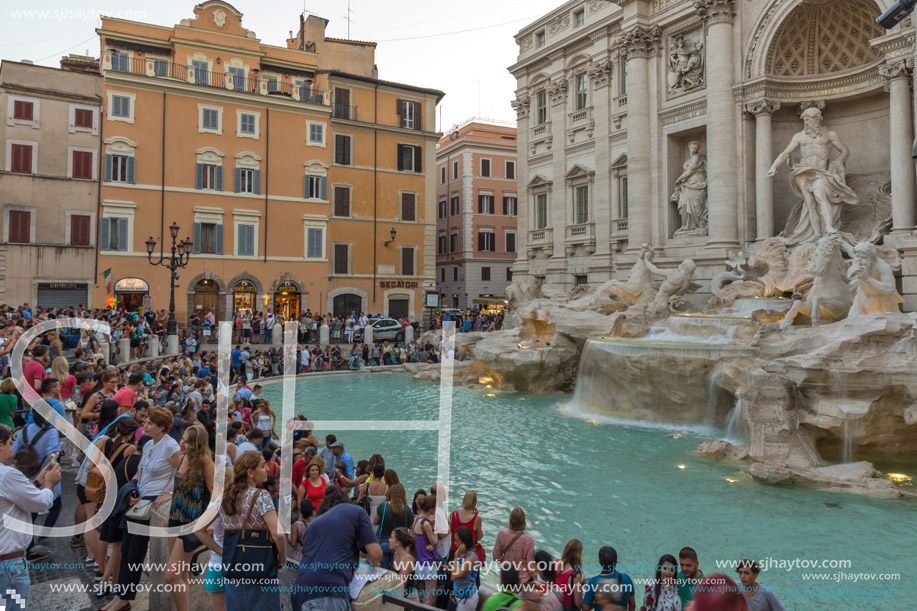 ROME, ITALY - JUNE 24, 2017: Sunset view of Tourist visiting Trevi Fountain (Fontana di Trevi) in city of Rome, Italy