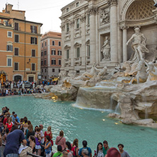 ROME, ITALY - JUNE 24, 2017: Sunset view of Tourist visiting Trevi Fountain (Fontana di Trevi) in city of Rome, Italy