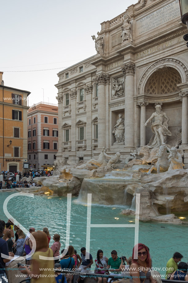 ROME, ITALY - JUNE 24, 2017: Sunset view of Tourist visiting Trevi Fountain (Fontana di Trevi) in city of Rome, Italy