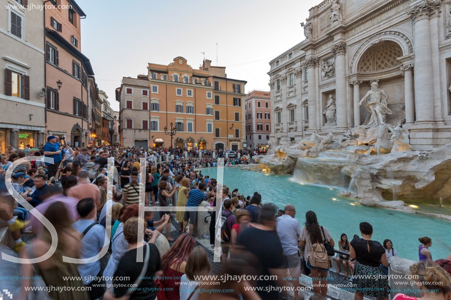 ROME, ITALY - JUNE 24, 2017: Sunset view of Tourist visiting Trevi Fountain (Fontana di Trevi) in city of Rome, Italy