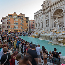 ROME, ITALY - JUNE 24, 2017: Sunset view of Tourist visiting Trevi Fountain (Fontana di Trevi) in city of Rome, Italy