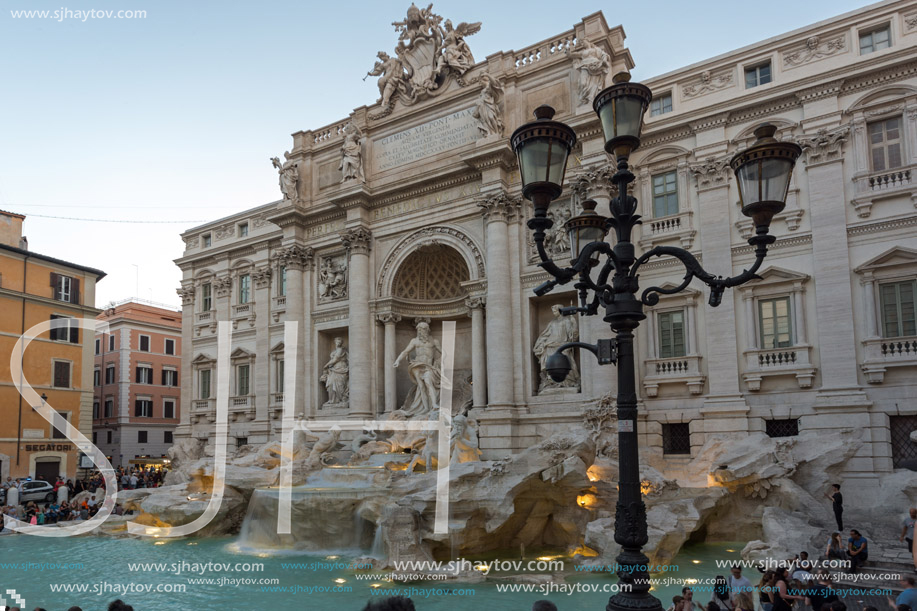 ROME, ITALY - JUNE 24, 2017: Sunset view of Tourist visiting Trevi Fountain (Fontana di Trevi) in city of Rome, Italy