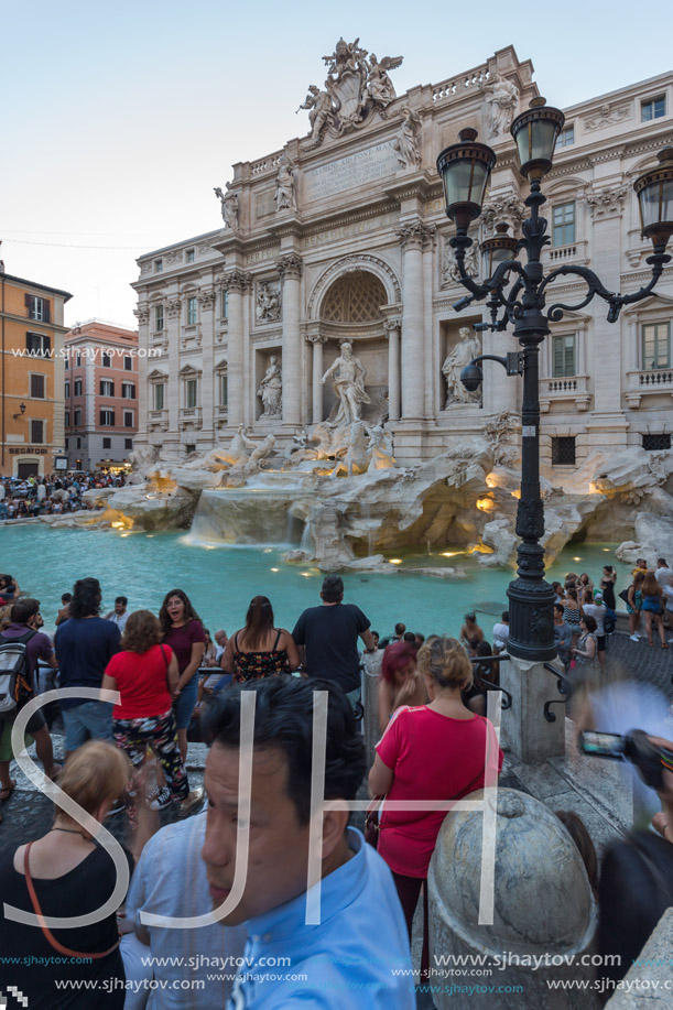 ROME, ITALY - JUNE 24, 2017: Sunset view of Tourist visiting Trevi Fountain (Fontana di Trevi) in city of Rome, Italy