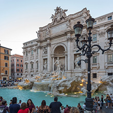 ROME, ITALY - JUNE 24, 2017: Sunset view of Tourist visiting Trevi Fountain (Fontana di Trevi) in city of Rome, Italy