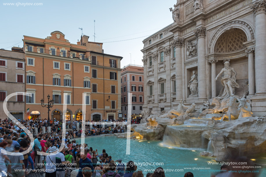 ROME, ITALY - JUNE 24, 2017: Sunset view of Tourist visiting Trevi Fountain (Fontana di Trevi) in city of Rome, Italy