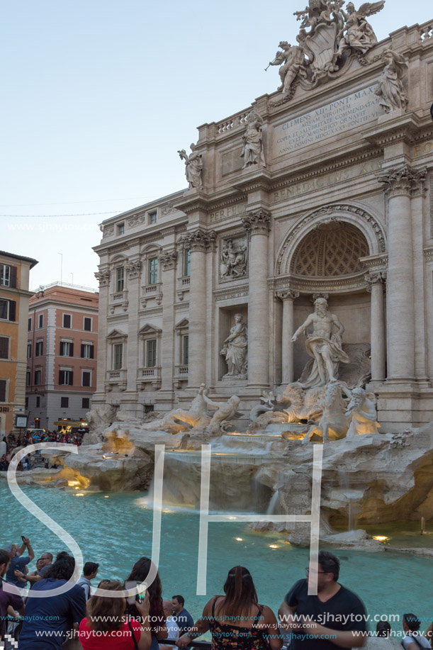 ROME, ITALY - JUNE 24, 2017: Sunset view of Tourist visiting Trevi Fountain (Fontana di Trevi) in city of Rome, Italy