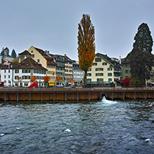 LUCERNE, SWITZERLAND - OCTOBER 28, 2015: The Reuss River River passes through the historic center of City of Luzern, Switzerland