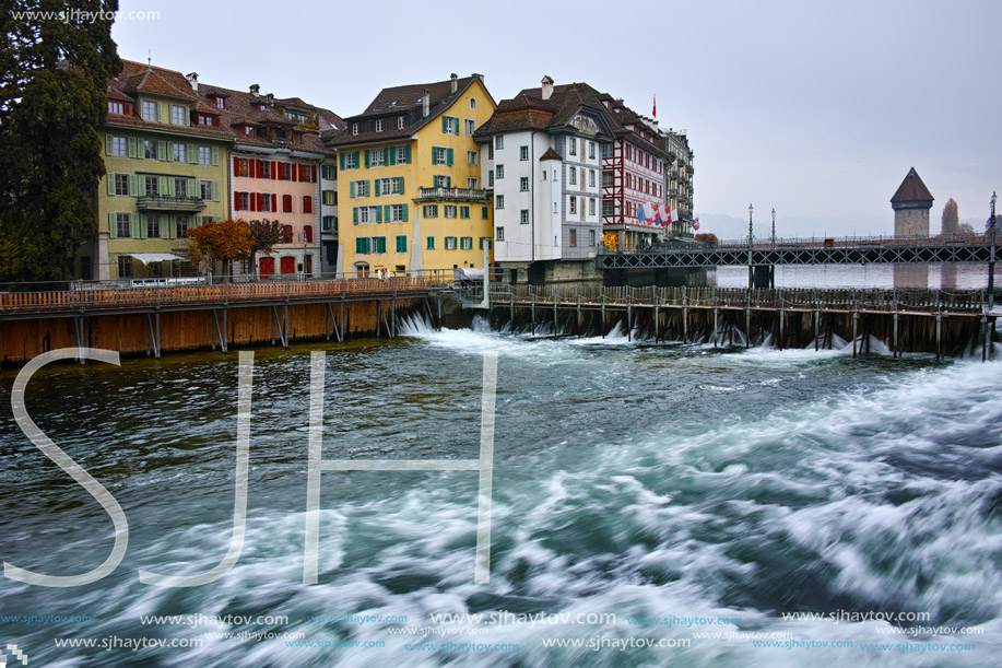 LUCERNE, SWITZERLAND - OCTOBER 28, 2015: The Reuss River River passes through the historic center of City of Luzern, Switzerland