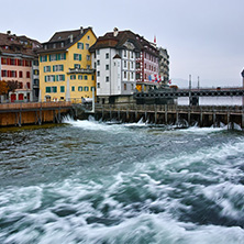 LUCERNE, SWITZERLAND - OCTOBER 28, 2015: The Reuss River River passes through the historic center of City of Luzern, Switzerland