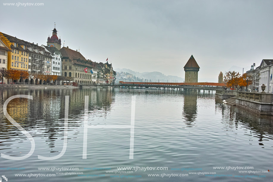 LUCERNE, SWITZERLAND - OCTOBER 28, 2015: foggy morning and Chapel Bridge over Reuss River, Lucerne, Switzerland
