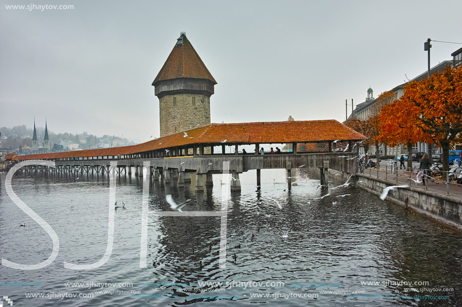 LUCERNE, SWITZERLAND - OCTOBER 28, 2015: foggy morning and Chapel Bridge over Reuss River, Lucerne, Switzerland