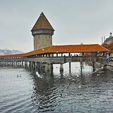 LUCERNE, SWITZERLAND - OCTOBER 28, 2015: foggy morning and Chapel Bridge over Reuss River, Lucerne, Switzerland