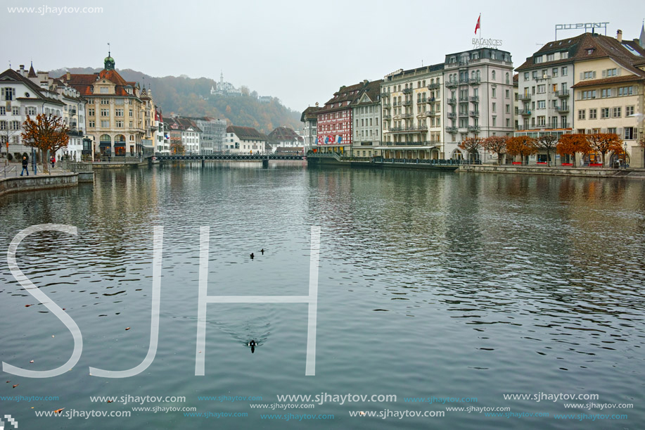 LUCERNE, SWITZERLAND - OCTOBER 28, 2015: The Reuss River River passes through the historic center of City of Luzern, Switzerland