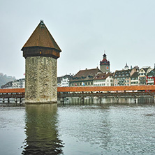 LUCERNE, SWITZERLAND - OCTOBER 28, 2015: foggy morning and Chapel Bridge over Reuss River, Lucerne, Switzerland