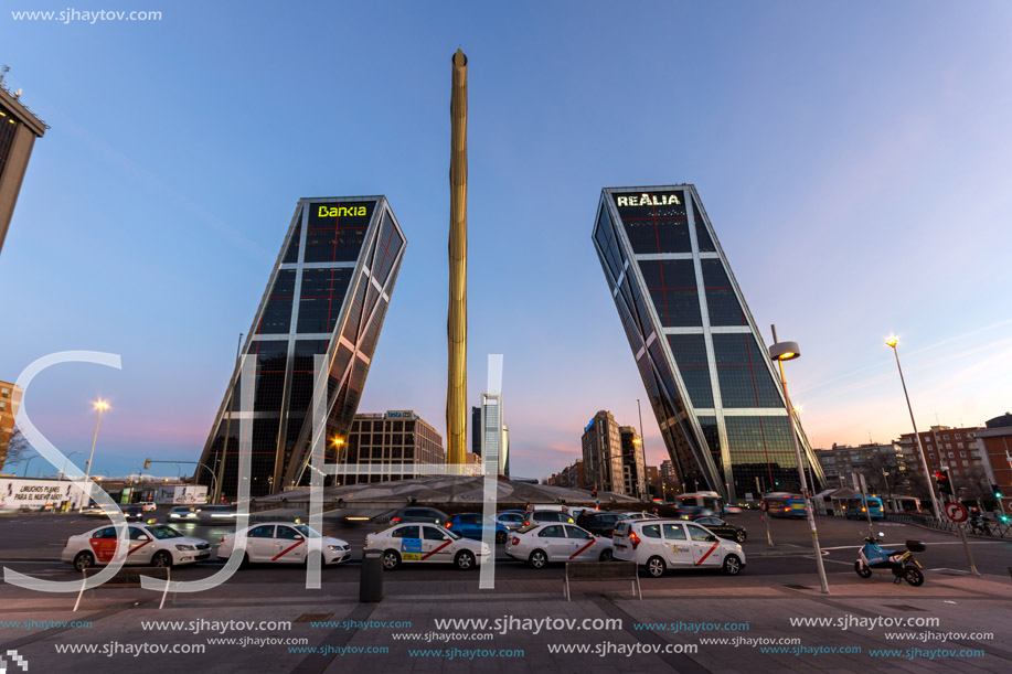 MADRID, SPAIN - JANUARY 23, 2018:  Sunrise view of Gate of Europe (KIO Towers) and Obelisk of Calatrava at Paseo de la Castellana street in City of Madrid, Spain