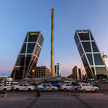 MADRID, SPAIN - JANUARY 23, 2018:  Sunrise view of Gate of Europe (KIO Towers) and Obelisk of Calatrava at Paseo de la Castellana street in City of Madrid, Spain