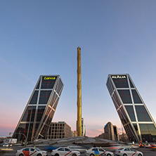 MADRID, SPAIN - JANUARY 23, 2018:  Sunrise view of Gate of Europe (KIO Towers) and Obelisk of Calatrava at Paseo de la Castellana street in City of Madrid, Spain