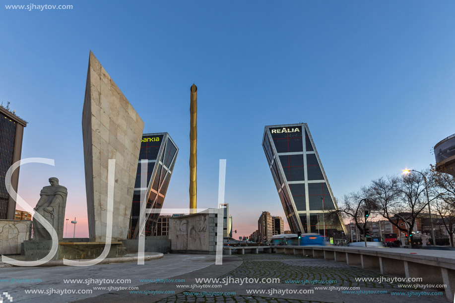 MADRID, SPAIN - JANUARY 23, 2018:  Sunrise view of Gate of Europe (KIO Towers) and Monument to Jose Calvo Sotelo at Paseo de la Castellana street in City of Madrid, Spain