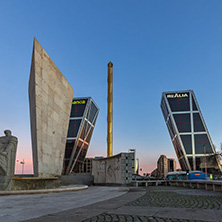 MADRID, SPAIN - JANUARY 23, 2018:  Sunrise view of Gate of Europe (KIO Towers) and Monument to Jose Calvo Sotelo at Paseo de la Castellana street in City of Madrid, Spain