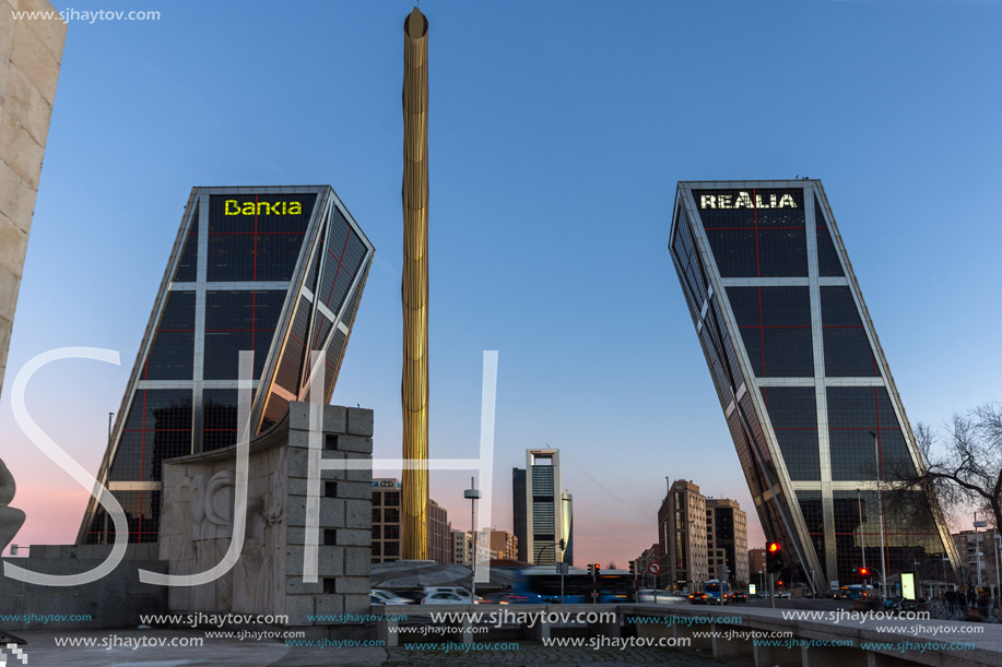 MADRID, SPAIN - JANUARY 23, 2018:  Sunrise view of Gate of Europe (KIO Towers) and Obelisk of Calatrava at Paseo de la Castellana street in City of Madrid, Spain