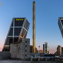 MADRID, SPAIN - JANUARY 23, 2018:  Sunrise view of Gate of Europe (KIO Towers) and Obelisk of Calatrava at Paseo de la Castellana street in City of Madrid, Spain