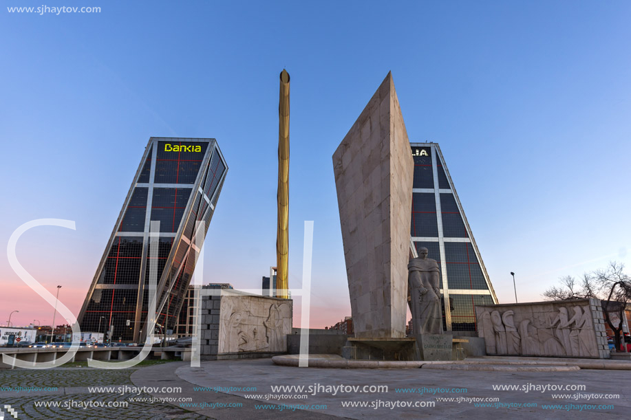 MADRID, SPAIN - JANUARY 23, 2018:  Sunrise view of Gate of Europe (KIO Towers) and Monument to Jose Calvo Sotelo at Paseo de la Castellana street in City of Madrid, Spain