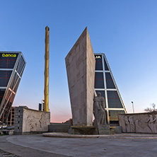 MADRID, SPAIN - JANUARY 23, 2018:  Sunrise view of Gate of Europe (KIO Towers) and Monument to Jose Calvo Sotelo at Paseo de la Castellana street in City of Madrid, Spain