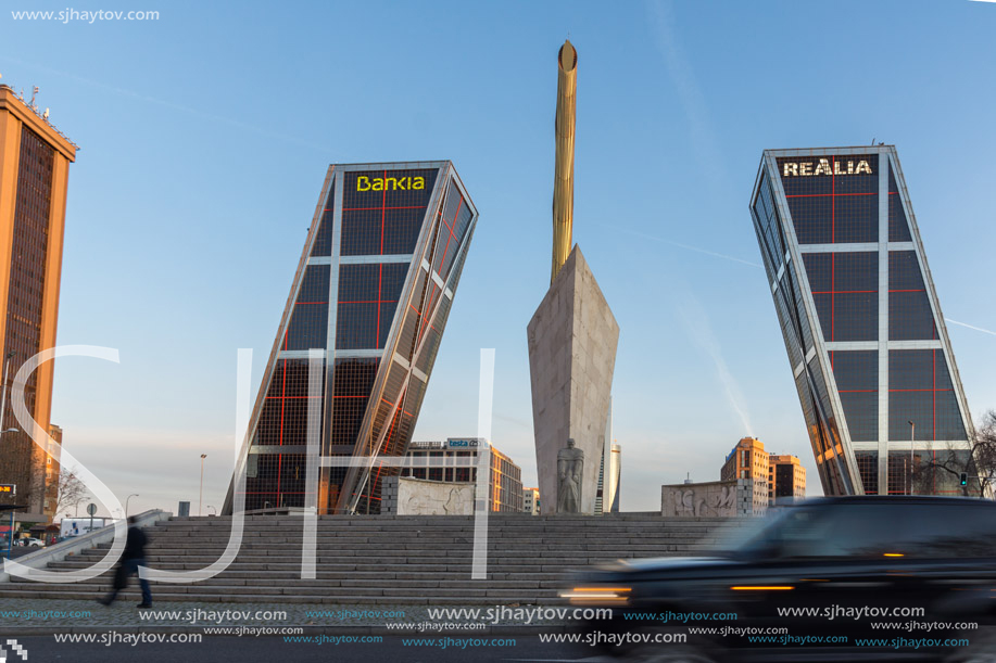 MADRID, SPAIN - JANUARY 23, 2018:  Sunrise view of Gate of Europe (KIO Towers) and Monument to Jose Calvo Sotelo at Paseo de la Castellana street in City of Madrid, Spain